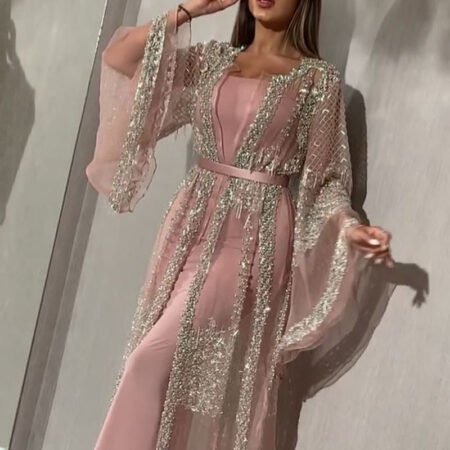Shine effortlessly in the Independent Stand Bronzing Two-Piece Cocktail Dress, a glamorous set that radiates confidence and allure. With its shimmering metallic finish and elegant shawl overlay, it’s the perfect statement for evening parties or special occasions.