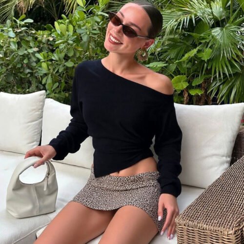 Meet the effortlessly chic Slim Fit Slit Shoulder Top, where simplicity meets modern sophistication.