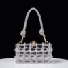 Sleek and minimal, the Transparent Square Rope Handbag brings modern artistry to your spring and summer wardrobe—perfect for women who love clean, creative design. Long Description: Combining transparent craftsmanship with hand-braided rope detailing, this small square handbag offers a chic balance between structure and style. Ideal for beach outings or casual city strolls, its underarm design keeps it trendy and functional. Lightweight, durable, and fashion-forward—it’s a must-have for the modern minimalist.