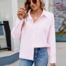 Master the art of effortless cool with this striped, loose-fit long-sleeve shirt. The classic print meets a relaxed silhouette for a look that's perpetually in style, perfect for a breezy weekend or an elevated, creative workday.