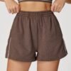 Relaxed, breathable, and effortlessly stylish, these high-waist sports shorts feature a loose fit with contrast color accents. Designed with functional pockets, they’re perfect for outdoor activities, casual days, and comfortable athleisure styling. The High Waist Loose Contrast Color Sports Shorts combine comfort and versatility for women on the move. Featuring a relaxed straight-leg fit, these shorts allow easy airflow and unrestricted movement. The high-waist waistband offers light support, while side pockets add practical functionality for daily wear.