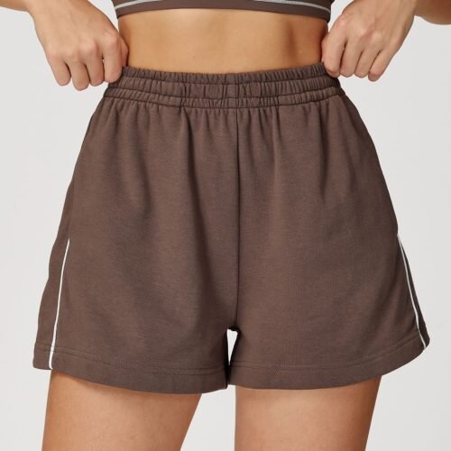 Relaxed, breathable, and effortlessly stylish, these high-waist sports shorts feature a loose fit with contrast color accents. Designed with functional pockets, they’re perfect for outdoor activities, casual days, and comfortable athleisure styling. The High Waist Loose Contrast Color Sports Shorts combine comfort and versatility for women on the move. Featuring a relaxed straight-leg fit, these shorts allow easy airflow and unrestricted movement. The high-waist waistband offers light support, while side pockets add practical functionality for daily wear.
